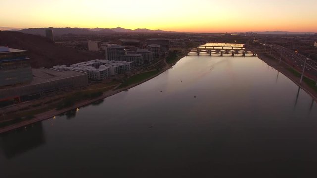 aerial drone footage of tempe town lake in arizona at sunset