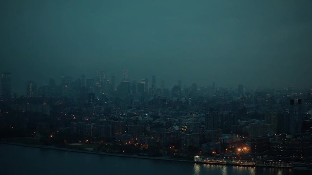 Surreal Manhattan NYC skyline in a very hazy sunset in 4K.  Very cyberpunk or Gotham City looking!