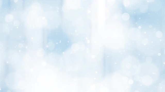 Beautiful blue colored bokeh with falling snow background. 