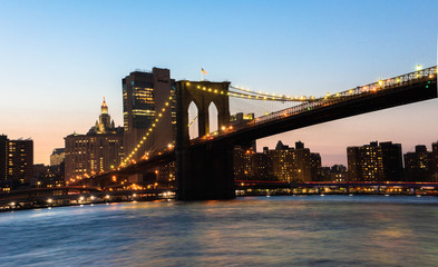 brooklyn bridge and new york manhattan at sunset