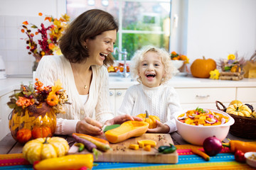 Family cooking pumpkin soup for Halloween lunch