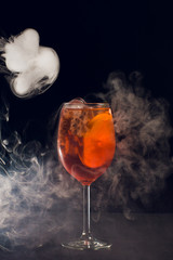 Beautiful cocktail isolated with dry ice smoke.