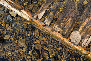  Background of beautiful mountain river stones and old boards