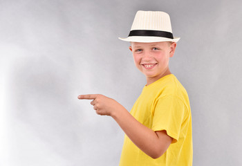 The boy in the hat. A young man in a yellow T-shirt.
