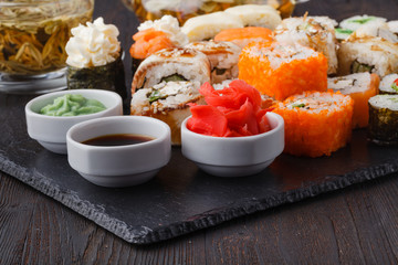 Japan rolls with fish and rice, pile asorted on table