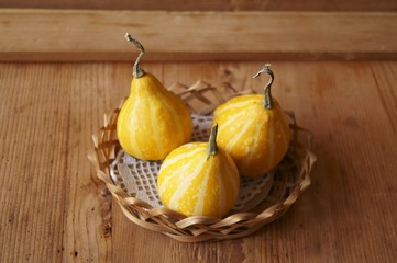 Gourd (pumpkins) on rustic background - background for Halloween
