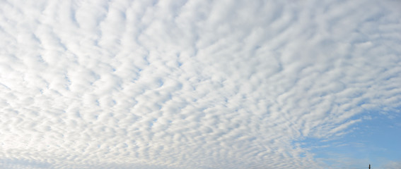 Wide angle view of cloudscape as natural background.