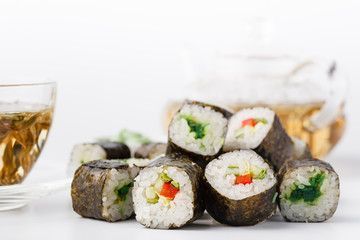 Pile of Various kinds of sushi served on black stone