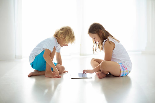 Child with tablet computer. PC for kids.