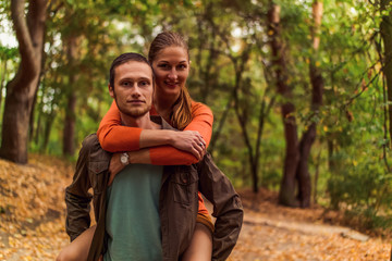 Portrait of couples against a backdrop of autumn forest