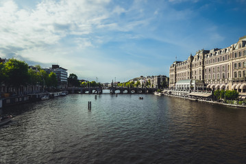 Naklejka premium A river flowing through the great Amsterdam.