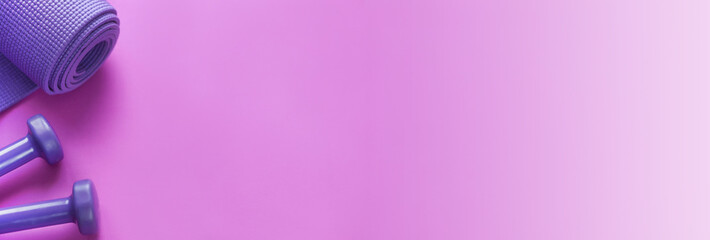 Banner of fitness concept with dumbbells, and a mat, on a pink background.