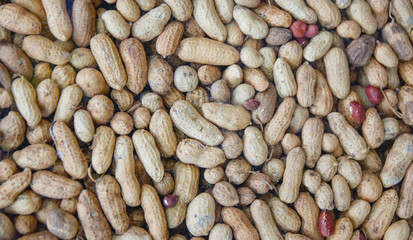Texture and background of peanuts with peel.