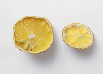 Two pieces of old drying lemon