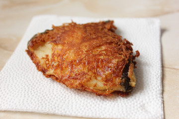 Grilled fish on white plate