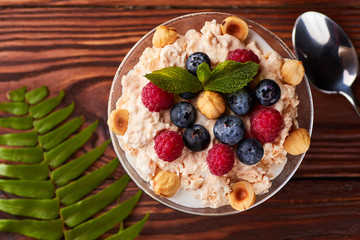 Frozen creamy ice yoghurt with berries and nuts