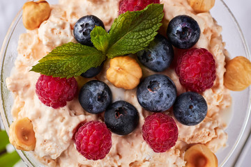 Frozen creamy ice yoghurt with berries and nuts