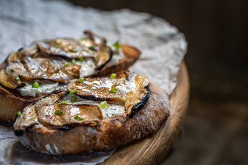 Bruschetta with porcini mushrooms and soft cheese