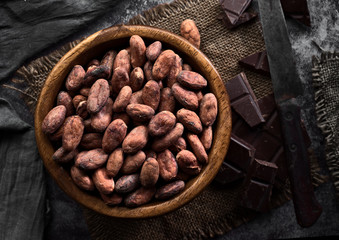 wooden bowl filled with cocoa seeds