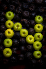 letters of the alphabet lined with green apples