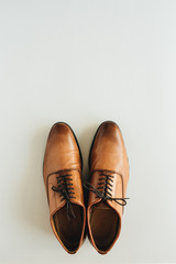 Men's leather shoes. Flat lay, top view fashion background