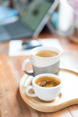 Hot latte art coffee  on wood table working background