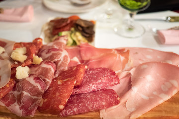 Assortment of tasty and delicious Italian antipasto. Prosciutto di Parma or Parma, Chorizo, Salami sausage, Bologna with cheese. A perfect appetizer, party snack, or good accompany with wine