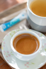 Hot espresso coffee on wood table
