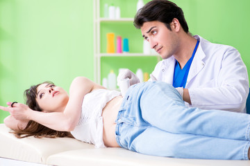 Pregnant woman visiting radiologyst for ultrasound 