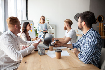 Young team of coworkers making great business discussion in modern coworking office.Teamwork people concept