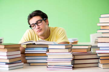 Student with too many books to read before exam