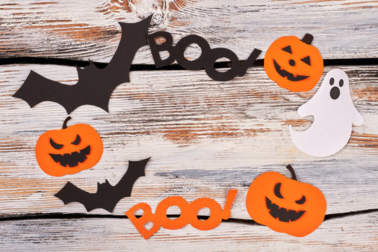 Frame from Halloween paper silhouettes. Colorful paper cutouts for Halloween, copy space. Halloween holiday greeting card.