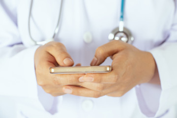 Asian women using her cell phone