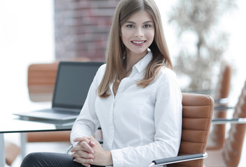 portrait of modern business woman sitting on a chair