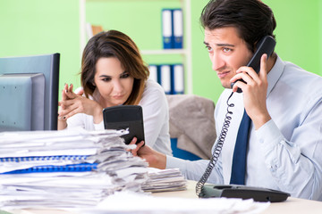 Two financial specialists working in the office