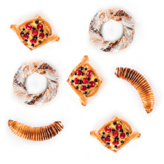 Set of assorted sweet pastries isolated on white background. Concept of pastry, top view