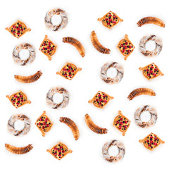Ensemble of many delicious and assorted pastries side by side isolated on white background, top view