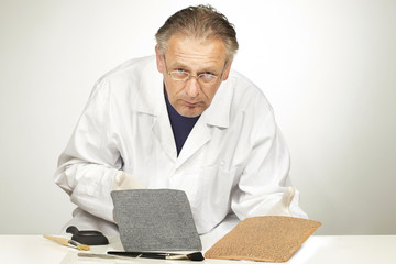 Scientist exploring ancient type of Akkad empire style cuneiform with tweezers