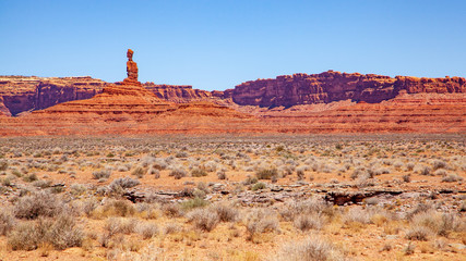 Iconic Southwest US desert brown sandstone monument in the former Bears Ear National Monument located in the Valley of the Gods, Mexican Hat, Utah