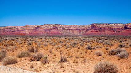 Iconic Southwest US desert brown sandstone monument in the former Bears Ear National Monument located in the Valley of the Gods, Mexican Hat, Utah