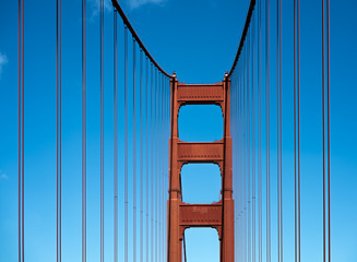 Golden Gate Bridge, San Francisco - red steel structure against bright blue sky