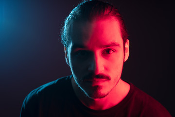 Cinematic portrait of man with lights and prism