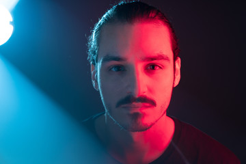 Cinematic portrait of man with lights and prism