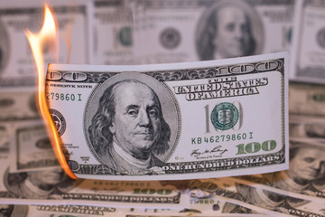 Burning one hundred dollar