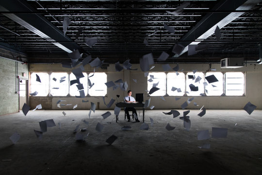Man working at desk in abandoned building