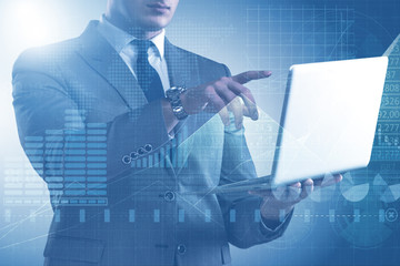 Businessman with laptop in finance and banking concept