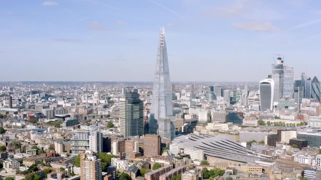 London City Panoramic Aerial View around Famous Glass and Steel Tower The Shard, most recognizable Skyscrapers and Iconic St. Paul's Cathedral completing the Skyline in England, United Kingdom - 4K HD