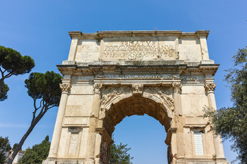 Fototapeta na wymiar Arch of Titus in Roman Forum in city of Rome, Italy