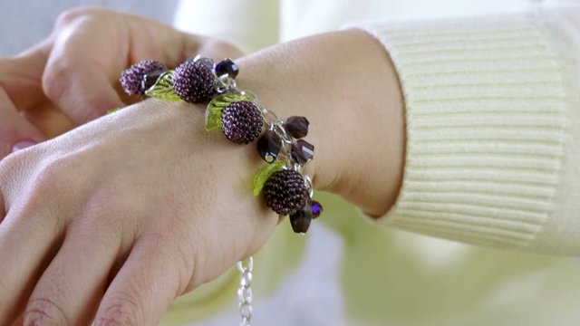 Unique handmade bracelet. Jewelry designer creating handmade jewelry in studio. 4K