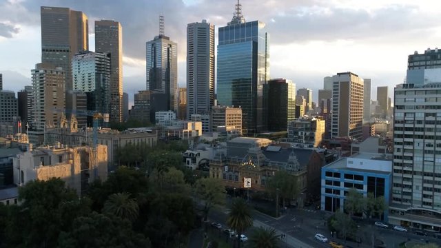 Aerial view of Melbourne CBD at sunset parliament building and princess theatre visible